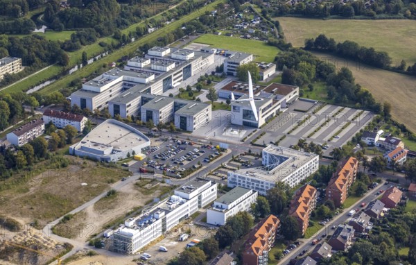Aerial view, Hamm-Lippstadt University of Applied Sciences and the construction site at SCI:Q Science Quarter with the Duo Discus high-performance double-seater D-4199 in the Mitte district of Hamm, Ruhr area, North Rhine-Westphalia, Germany, construction work, construction, construction area, building site, building plots, construction project, construction site, education, educational institution, DE, Europe, aircraft, business park, property tax, Hamm, real estate, industrial area, aerial photography, aerial photography, aerial photography, Marker Allee, Rhine-Ruhr metropolitan region, new build, Paracelsuspark, Science Quarter Hamm, sailor, tech park, overview, university, bird's-eye view, science quarter, residential complex, living and living, residential area, residential buildings, residential quality, residential neighbourhood, housing estate, birds-eyes view, overview
