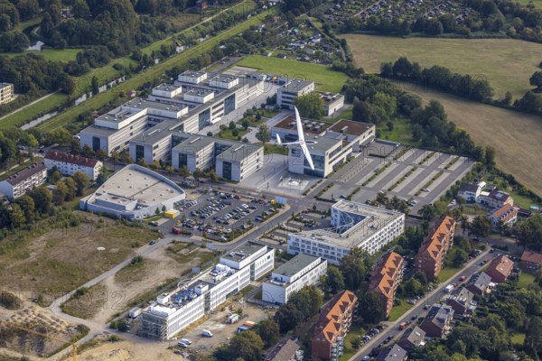 Aerial view, Hamm-Lippstadt University of Applied Sciences and the construction site at SCI:Q Science Quarter with the Duo Discus high-performance double-seater D-4199 in the Mitte district of Hamm, Ruhr area, North Rhine-Westphalia, Germany, construction work, construction, construction area, building site, building plots, construction project, construction site, education, educational institution, DE, Europe, aircraft, business park, property tax, Hamm, real estate, industrial area, aerial photography, aerial photography, aerial photography, Marker Allee, Rhine-Ruhr metropolitan region, new build, Paracelsuspark, Science Quarter Hamm, sailor, tech park, overview, university, bird's-eye view, science quarter, residential complex, living and living, residential area, residential buildings, residential quality, residential neighbourhood, housing estate, birds-eyes view, overview