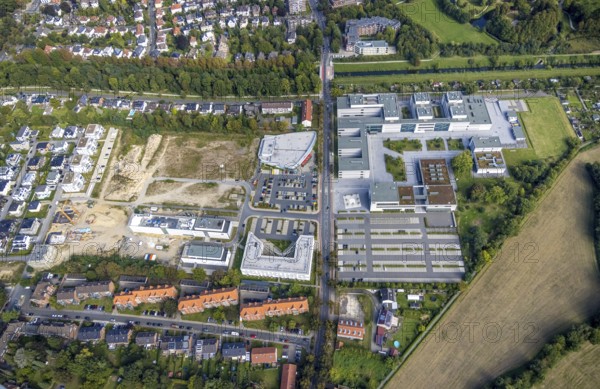 Aerial view, Hamm-Lippstadt University of Applied Sciences and the construction site at SCI:Q Science Quarter in the Mitte district of Hamm, Ruhr area, North Rhine-Westphalia, Germany, construction work, building, construction area, building site, building plots, construction project, construction site, education, educational institution, DE, Europe, business park, property tax, Hamm, real estate, industrial area, aerial photograph, aerial photography, aerial photography, Marker Allee, Rhine-Ruhr metropolitan region, new build, Paracelsuspark, Science Quarter Hamm, Techpark, overview, university, bird's-eye view, science quarter, residential complex, living and living, residential area, residential buildings, residential quality, residential quarter, housing estate, birds-eyes view, overview