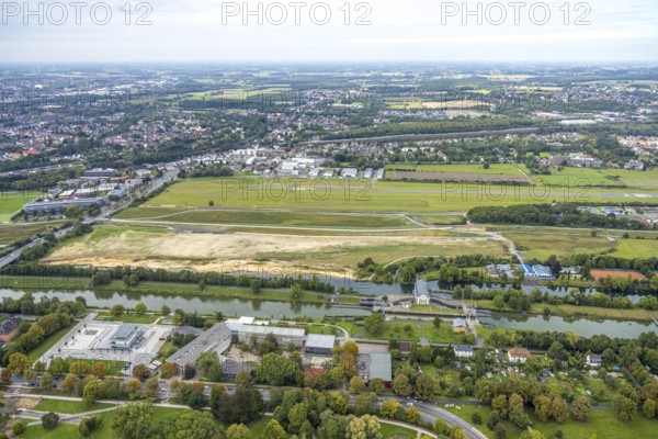 Aerial view, Hamm airfield and construction site for the Lippe floodplain project on the river Lippe and the Hammonense water sports centre with grammar school on Adenauerallee in the Mitte district of Hamm, Ruhr area, North Rhine-Westphalia, Germany, construction area, construction site, building plots, construction project, building site, education, educational institution, DE, Europe, airfield, grammar school, Hamm, educational institute, aerial view, aerial photography, aerial photography, school, swimming pool, sports, overview, bird's-eye view, overview