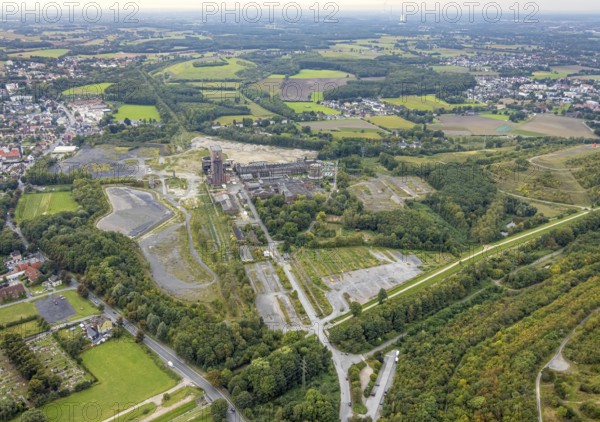 Aerial view, former Ost colliery Heinrich Robert colliery with hammer tower in the district Herringen in Hamm, Ruhr area, North Rhine-Westphalia, Germany, mine, Heinrich Robert colliery, DE, Europe, commercial enterprises, commercial area, commercial park, commercial location, commercial use, Hamm, industrial plant, industrial area, industrial building, industrial site, aerial view, aerial photography, aerial photography, Rhine-Ruhr metropolitan region, coal mine, tower, overview, bird's-eye view, birds-eyes view, former Ost colliery, historical, historical site, overview, destroyed building