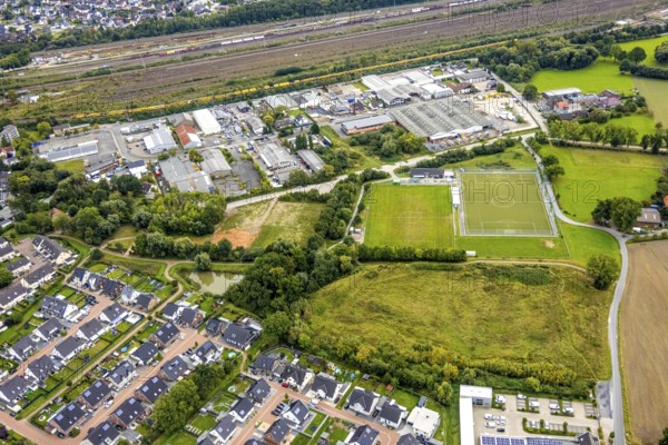 Aerial view, commercial area Schieferstraße and fallow land at the sports facility TuS Germania Lohauserholz-Daberg in the district Pelkum in Hamm, Ruhr area, North Rhine-Westphalia, Germany, DE, Europe, football pitch, commercial enterprises, commercial area, commercial area, commercial park, commercial location, commercial use, Hamm, industrial area, industrial location, aerial view, aerial photography, aerial photography, sports facilities, sports field, sports facility, overview, bird's eye view, birds-eyes view, overview
