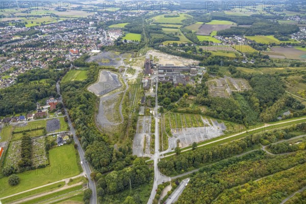 Aerial view, former Ost colliery Heinrich Robert colliery with hammer tower in the district Herringen in Hamm, Ruhr area, North Rhine-Westphalia, Germany, mine, Heinrich Robert colliery, DE, Europe, commercial enterprises, commercial area, commercial park, commercial location, commercial use, Hamm, industrial plant, industrial area, industrial building, industrial site, aerial view, aerial photography, aerial photography, Rhine-Ruhr metropolitan region, coal mine, tower, overview, bird's-eye view, birds-eyes view, former Ost colliery, historical, historical site, overview, destroyed building