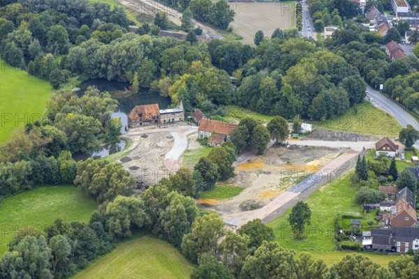 Aerial view, construction site and renovation of the Schlossmühle am Mühlengraben am Mühlenteich in the district Heessen in Hamm, Ruhr area, North Rhine-Westphalia, Germany, construction work, construction area, building site, building plots, construction project, construction site, DE, Europe, Hamm, aerial view, aerial photography, aerial photography, aerial photography, renovation, overview, bird's-eye view, overview