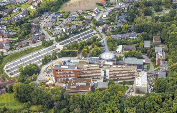 Aerial view, construction site with extension at the St. Barbara Clinic in the district of Heessen in Hamm, Ruhr area, North Rhine-Westphalia, Germany, construction work, construction, construction area, building site, building plots, construction project, construction site, DE, Europe, healthcare, Hamm, hospital, helipad, clinic, clinic centre, hospital, aerial photograph, aerial photography, aerial photography, medical facility, medical aid, new building, car park, overview, bird's eye view, bird's eye view, overview, medical care
