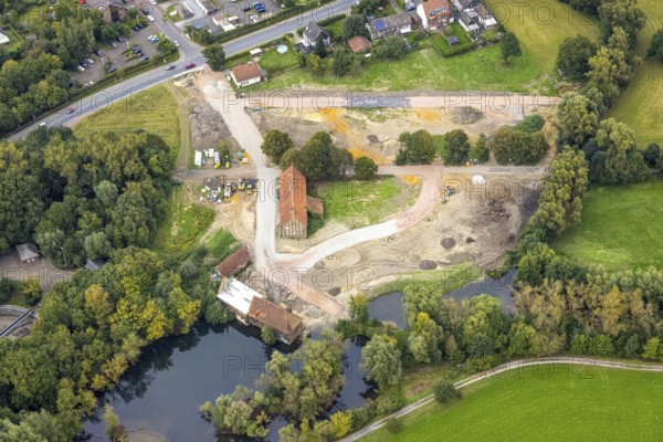 Aerial view, construction site and renovation of the Schlossmühle am Mühlengraben am Mühlenteich in the district Heessen in Hamm, Ruhr area, North Rhine-Westphalia, Germany, construction work, construction area, building site, building plots, construction project, construction site, DE, Europe, Hamm, aerial view, aerial photography, aerial photography, aerial photography, renovation, overview, bird's-eye view, overview