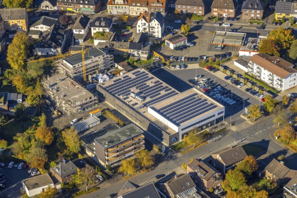 Aerial view, construction site and new building Heessener Gärten at the Aldi supermarket with solar roof Kleine Amtsstraße in the district Heessen in Hamm, Ruhr area, North Rhine-Westphalia, Germany, DE, shopping markets, shopping centre, Europe, Hamm, aerial view, aerial photography, aerial photography, metropolitan region Rhine-Ruhr, local supply centre, photovoltaic, photovoltaic system, solar, solar system, solar roof, solar energy, supermarket, overview, bird's eye view, birds-eyes view, overview