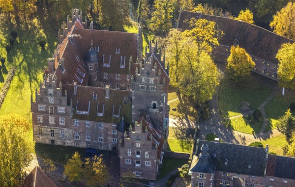 Aerial view, Heessen Castle with public school and boarding school in the autumnal forest in the district of Heessen in Hamm, Ruhr area, North Rhine-Westphalia, Germany, education, educational institution, castle, DE, Europe, aircraft, Hamm, autumn colours, educational institute, aerial view, aerial photography, aerial photography, motor glider, castle, castle complex, school, overview, bird's-eye view, overview