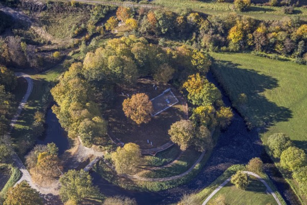Aerial view, Burghügel Mark surrounded by moats in the district Uentrop in Hamm, Ruhr area, North Rhine-Westphalia, Germany, ground monument, castle, Burg Mark, Burgplatz, DE, Europe, moat, green trees, Hamm, autumn colours, aerial view, aerial photography, aerial photography, Marker Burghügel, local recreation area, sight, Soester Straße, overview, bird's-eye view, birds-eyes view, historical, medieval fortification, overview