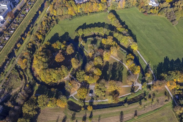 Aerial view, Burghügel Mark surrounded by moats in the district Uentrop in Hamm, Ruhr area, North Rhine-Westphalia, Germany, ground monument, castle, Burg Mark, Burgplatz, DE, Europe, moat, green trees, Hamm, autumn colours, aerial view, aerial photography, aerial photography, Marker Burghügel, local recreation area, sight, Soester Straße, overview, bird's-eye view, birds-eyes view, historical, medieval fortification, overview