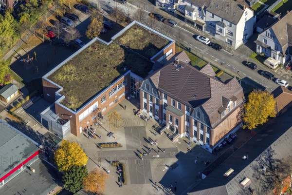 Aerial view, Overbergschule and pupils and cross on the schoolyard in the district Bockum-Hövel in Hamm, Ruhr area, North Rhine-Westphalia, Germany, education, educational institution, DE, Europe, Hamm, educational institute, aerial view, aerial photography, aerial photography, school, overview, bird's eye view, birds-eyes view, overview