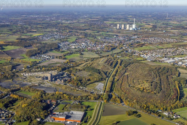 Aerial view, Kissinger Höhe slag heap and Ost Zeche Heinrich Robert colliery with hammerhead tower and CreativRevier Hamm and in the background the RWE Power AG Gersteinwerk power station in the Pelkum district of Hamm, Ruhr area, North Rhine-Westphalia, Germany, slag heap, mine, Heinrich Robert colliery, DE, Europe, distant view, commercial enterprises, commercial area, commercial park, commercial location, commercial use, spoil tip, spoil tip landscape, spoil tip sign, Hamm, Herringer Bach, industrial plants, industrial area, industrial building, industrial site, power plant, aerial view, aerial photography, aerial photography, coal mine, tower, overview, bird's eye view, hiking area, birds-eyes view, former Ost colliery, historical, historical site, overview, destroyed building