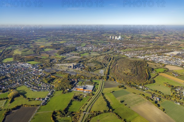 Aerial view, Kissinger Höhe slag heap and Ost Zeche Heinrich Robert colliery with hammerhead tower and CreativRevier Hamm and in the background the RWE Power AG Gersteinwerk power station in the Pelkum district of Hamm, Ruhr area, North Rhine-Westphalia, Germany, slag heap, mine, Heinrich Robert colliery, DE, Europe, distant view, commercial enterprises, commercial area, commercial park, commercial location, commercial use, spoil tip, spoil tip landscape, spoil tip sign, Hamm, Herringer Bach, industrial plants, industrial area, industrial building, industrial site, power plant, aerial view, aerial photography, aerial photography, coal mine, tower, overview, bird's eye view, hiking area, birds-eyes view, former Ost colliery, historical, historical site, overview, destroyed building