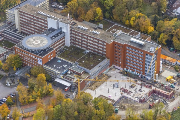 Aerial view, construction site with extension building at the St. Barbara-Klinik Hamm-Heessen in the district of Heessen in Hamm, Ruhr area, North Rhine-Westphalia, Germany, construction work, building, construction area, building site, building plots, construction project, construction site, DE, Europe, healthcare, Hamm, hospital, helipad, clinic, hospital centre, hospital, aerial photograph, aerial photography, aerial photography, medical facility, medical aid, new building, overview, bird's eye view, overview, medical care