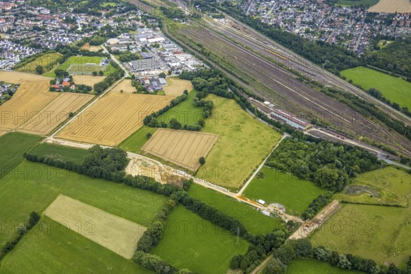 Aerial view, meadows and fields and construction site Wiescher Bach, Pelkum, Hamm, Ruhr area, North Rhine-Westphalia, Germany, construction work, construction area, building site, building plots, construction project, construction site, DE, Europe, aerial view, aerial photography, aerial photography, signal box, overview, bird's-eye view, overview