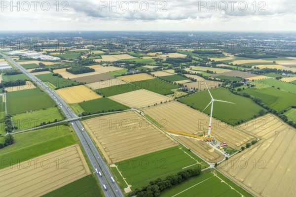 Aerial view, meadows and fields with construction site and new wind turbine, Rhynern, Hamm, Ruhr area, North Rhine-Westphalia, Germany, motorway A2, DE, Europe, distant view, aerial view, aerial photography, aerial photography, mosaic form, overview, bird's-eye view, WTG, meadows and fields, wind energy, wind energy plant, wind power, wind turbine, wind turbines, birds-eyes view, overview