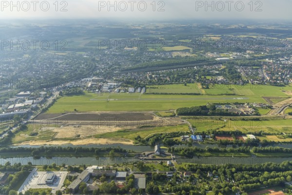 Aerial photo, Gymnasium Hammonense, new water sports centre, construction site Lippe reconstruction protective dam at Jupp-Eickhoff-Weg, Lippe beach, Hamm-Lippewiesen airfield, Heessen, Hamm, Ruhr area, North Rhine-Westphalia, Germany, construction work, construction area, construction site, building plots, construction, construction project, construction site, education, educational institution, DE, Europe, flight mission, airport, airfield, grammar school, runway, educational institute, aerial photography, aerial photography, aerial photography, school, runway, overview, bird's-eye view, birds-eyes view, overview