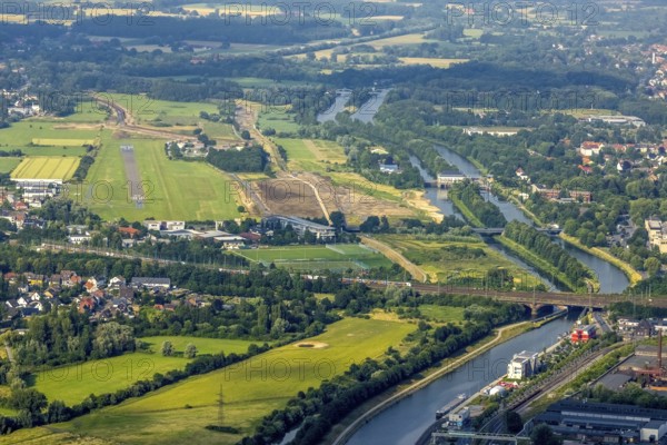 Aerial photograph, Hamm-Lippewiesen airfield, Lippe floodplain, Hamm lock, Lippe river, Datteln-Hamm canal, construction site for protective dam on Jupp-Eickhoff-Weg, Lippe beach, Heessen, Hamm, Ruhr area, North Rhine-Westphalia, Germany, construction work, construction area, construction site, construction, construction project, construction site, DE, Europe, flight emission, airport, aircraft noise, airfield, runway, aerial view, aerial photography, aerial photography, North Rhine-Westphalia, runway, overview, birds-eyes view, overview
