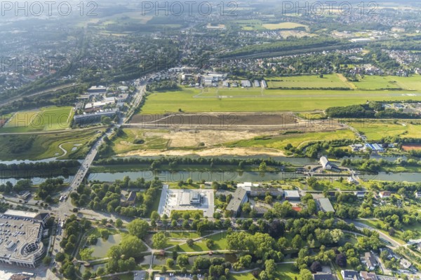 Aerial view, Hammonense grammar school, new water sports centre, construction site for protective dam on Jupp-Eickhoff-Weg, Lippe beach, Hamm-Lippewiesen airfield, Heessen, Hamm, Ruhr area, North Rhine-Westphalia, Germany, construction work, construction area, construction site, building plots, construction, construction project, construction site, education, educational institution, DE, Europe, flight mission, airport, airfield, grammar school, runway, educational institute, aerial photography, aerial photography, aerial photography, school, runway, overview, bird's-eye view, birds-eyes view, overview