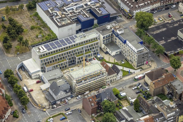 Aerial photo, Widumstraße construction site for new WA office building, Westfälischer Anzeiger, centre, Hamm, Ruhr area, North Rhine-Westphalia, Germany, construction work, construction, construction area, construction site, building plots, construction project, construction site, DE, Europe, commercial enterprises, commercial area, commercial area, commercial site, commercial use, aerial view, aerial photography, aerial photography, new building, photovoltaic, photovoltaic plant, solar, solar plant, solar energy, solar energy, Stadtanzeiger Hamm, overview, bird's-eye view, newspaper publisher, birds-eyes view, overview