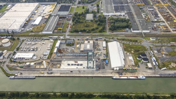 Aerial view, industrial area harbour with construction site Lanfer site and loading terminal at the Datteln-Hamm canal in the district Herringen in Hamm, Ruhr area, North Rhine-Westphalia, Germany, construction work, construction area, building site, building plots, construction project, construction site, DE, Datteln-Hamm canal, Europe, industrial area, industrial estate, industrial park, commercial use, Hamm, industrial plants, industrial area, industrial site, canal, Lanfer Logistik, aerial view, aerial photography, aerial photography, production plants, production halls, overview, bird's eye view, birds-eyes view, overview