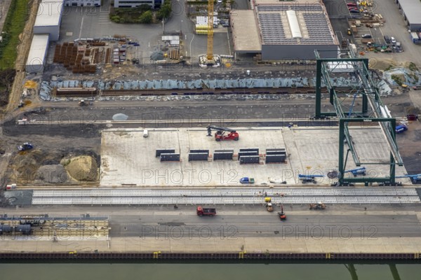 Aerial view, industrial area harbour with construction site Lanfer site and loading terminal at the Datteln-Hamm canal in the district Herringen in Hamm, Ruhr area, North Rhine-Westphalia, Germany, construction work, construction area, building site, building plots, construction project, construction site, DE, Datteln-Hamm canal, Europe, industrial area, industrial estate, industrial park, commercial use, Hamm, industrial plants, industrial area, industrial site, canal, Lanfer Logistik, aerial view, aerial photography, aerial photography, production plants, production halls, overview, bird's eye view, birds-eyes view, overview