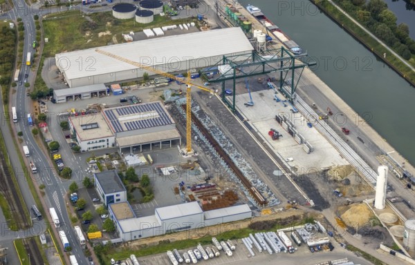 Aerial view, industrial area harbour with construction site Lanfer site and loading terminal at the Datteln-Hamm canal in the district Herringen in Hamm, Ruhr area, North Rhine-Westphalia, Germany, construction work, construction area, building site, building plots, construction project, construction site, DE, Datteln-Hamm canal, Europe, industrial area, industrial estate, industrial park, commercial use, Hamm, industrial plants, industrial area, industrial site, canal, Lanfer Logistik, aerial view, aerial photography, aerial photography, production plants, production halls, overview, bird's eye view, birds-eyes view, overview
