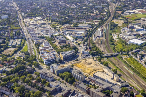 Aerial view, construction site new literature quarter for offices and flats on Sachsenstraße with demolition of the former newspaper quarter and in the background the ETEC Essener Technologie- und Entwicklungs-Centrum GmbH in the Südviertel in Essen, Ruhr area, North Rhine-Westphalia, Germany, construction work, construction area, construction site, building plots, building project, building site, DE, Essen, Europe, commercial enterprises, commercial area, commercial park, commercial location, commercial use, industrial area, industrial location, aerial view, aerial photography, aerial photography, new building, overview, bird's-eye view, overview