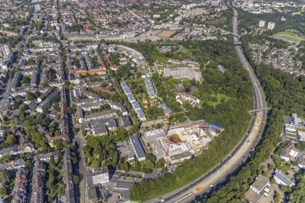 Aerial view, construction site and new construction of apartment buildings on Manfredstraße and construction site on the A52 motorway in Essen-Rüttenscheid, Essen, Ruhr area, North Rhine-Westphalia, Germany, motorway, construction work, construction area, construction site, building plots, construction crane, construction project, construction site, DE, Europe, property of the former Paas forwarding company, aerial view, aerial photography, aerial photography, new construction, overview, bird's-eye view, overview