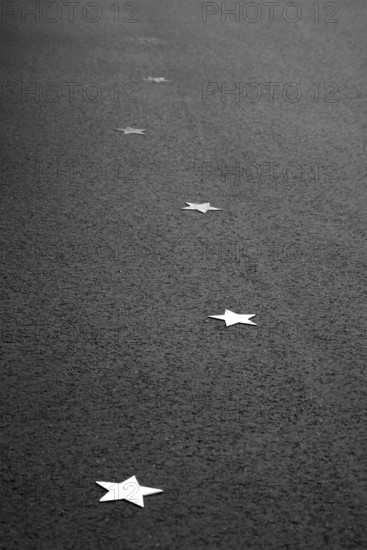 Stars on sidewalk as memorial for Nazi victims, Tilbeck Abbey, Tilbeck foundation, Havixbeck, Muensterland, North Rhine-Westphalia, Germany