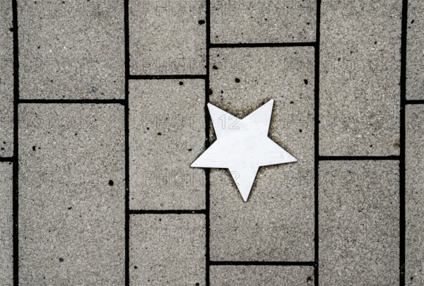 Stars on sidewalk as memorial for Nazi victims, Tilbeck Abbey, Tilbeck foundation, Havixbeck, Muensterland, North Rhine-Westphalia, Germany