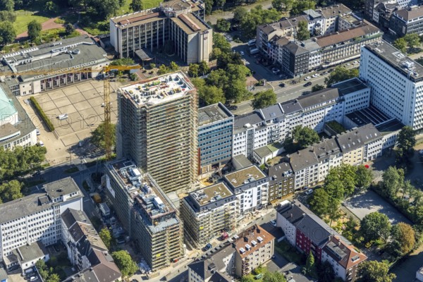 Aerial view, Philharmonie Essen and construction site new building complex with residential tower and senior citizens' flats on Huyssenallee in the southern district in Essen, Ruhr area, North Rhine-Westphalia, Germany, expansion areas, construction work, construction, construction area, construction site, construction crane, construction measure, construction project, construction site, care and nursing, DE, renewal, development, Essen, Europe, catering, hotel, hotel facilities, hotel industry, capacity requirements, concert hall, culture, art, aerial photography, aerial photography, aerial photography, new construction, care facility, retirement home, retirement centre, Sheraton Essen Hotel, overview, events, event location, event venue, event centre, bird's eye view, becoming and growing, birds-eyes view, cultural use, overview