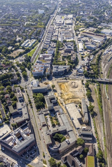 Aerial view, construction site new literature quarter for offices and flats on Sachsenstraße with demolition of the former newspaper quarter and in the background the ETEC Essener Technologie- und Entwicklungs-Centrum GmbH in the Südviertel in Essen, Ruhr area, North Rhine-Westphalia, Germany, construction work, construction area, construction site, building plots, building project, building site, DE, Essen, Europe, commercial enterprises, commercial area, commercial park, commercial location, commercial use, industrial area, industrial location, aerial view, aerial photography, aerial photography, new building, overview, bird's-eye view, overview