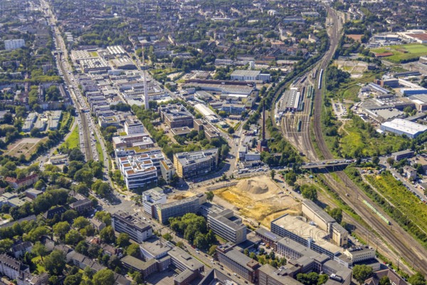 Aerial view, construction site new literature quarter for offices and flats on Sachsenstraße with demolition of the former newspaper quarter and in the background the ETEC Essener Technologie- und Entwicklungs-Centrum GmbH in the Südviertel in Essen, Ruhr area, North Rhine-Westphalia, Germany, construction work, construction area, construction site, building plots, building project, building site, DE, Essen, Europe, commercial enterprises, commercial area, commercial park, commercial location, commercial use, industrial area, industrial location, aerial view, aerial photography, aerial photography, new building, overview, bird's-eye view, overview