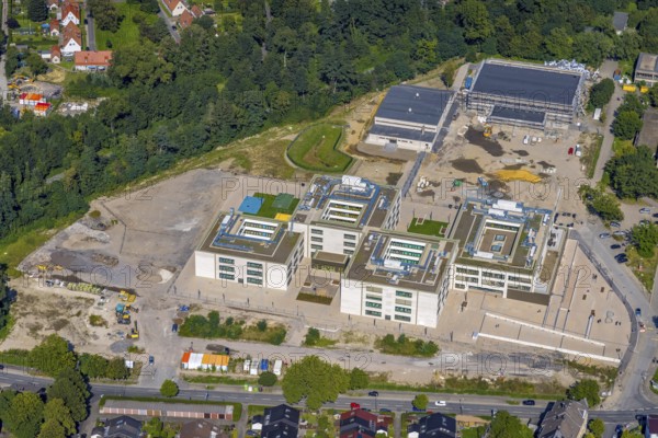 Aerial view, construction site and new building of the Gustav-Heinemann comprehensive school with sports halls in the district of Schonnebeck in Essen, Ruhr area, North Rhine-Westphalia, Germany, construction work, construction area, building site, building plots, construction project, construction site, education, educational institution, DE, Essen, Europe, comprehensive school, teaching institute, aerial view, aerial photography, aerial photography, new building, school, overview, bird's-eye view, overview