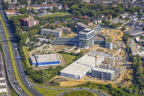Aerial view, construction site and new construction ALDI-Nord Campus on the A40 motorway, Am Luftschacht in Essen-Kray in Essen, Ruhr area, North Rhine-Westphalia, Germany, construction work, construction area, building site, building plots, construction crane, construction measure, construction project, construction site, Buderus branch Essen - Bosch Thermotechnik, DE, development, Essen, Europe, commercial enterprises, commercial area, commercial park, commercial site, commercial use, industrial site, capacity requirement, aerial photograph, aerial photography, aerial photography, new construction, overview, bird's-eye view, birds-eyes view, overview