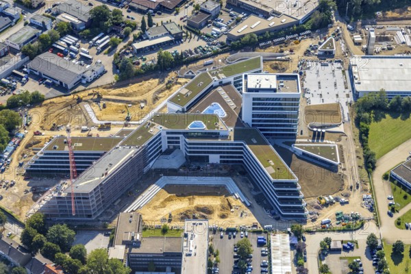 Aerial view, construction site and new construction ALDI-Nord Campus on the A40 motorway, Am Luftschacht in Essen-Kray in Essen, Ruhr area, North Rhine-Westphalia, Germany, construction work, construction area, building site, building plots, construction crane, construction project, construction site, DE, development, Essen, Europe, commercial enterprises, commercial area, commercial park, commercial site, commercial use, industrial site, capacity requirement, aerial view, aerial photography, aerial photography, new construction, overview, bird's-eye view, overview