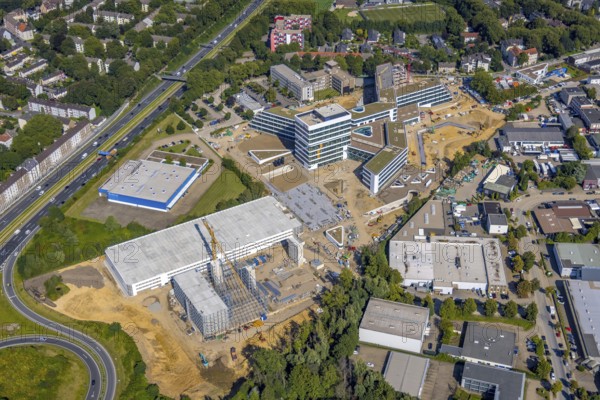 Aerial view, construction site and new construction ALDI-Nord Campus on the A40 motorway, Am Luftschacht in Essen-Kray in Essen, Ruhr area, North Rhine-Westphalia, Germany, construction work, construction area, building site, building plots, construction crane, construction project, construction site, DE, development, Essen, Europe, commercial enterprises, commercial area, commercial park, commercial site, commercial use, industrial site, capacity requirement, aerial view, aerial photography, aerial photography, new construction, overview, bird's-eye view, overview