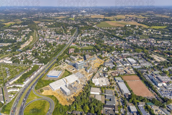 Aerial view, construction site and new construction ALDI-Nord Campus on the A40 motorway, Am Luftschacht in Essen-Kray in Essen, Ruhr area, North Rhine-Westphalia, Germany, construction work, construction area, building site, building plots, construction crane, construction measure, construction project, construction site, Buderus branch Essen - Bosch Thermotechnik, DE, development, Essen, Europe, commercial enterprises, commercial area, commercial park, commercial site, commercial use, industrial site, capacity requirement, aerial photograph, aerial photography, aerial photography, new construction, overview, bird's-eye view, birds-eyes view, overview