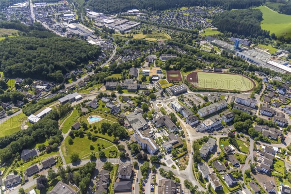 Aerial view, town hall Finnentrop Am Markt, Finto swimming pool, Bigge-Lenne comprehensive school, sports field at the school centre, construction site at Kopernikusstraße, Finnentrop, Sauerland, North Rhine-Westphalia, Germany, bathing establishment, bathing resort, construction work, construction area, building site, building plots, construction measure, construction project, construction site, authority, education, educational institution, DE, Europe, football pitch, football stadium, comprehensive school, roundabout, roundabout, teaching institute, athletics stadium, aerial view, aerial photography, aerial photography, new building, town hall, school, swimming pool, swimming pool, sports, sports facilities, sports field, sports facility, overview, bird's eye view, birds-eyes view, overview