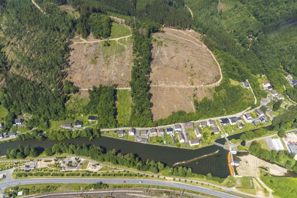Aerial view, forest area and forest damage on Lennestraße at the historic Lennewehr, Finnentrop, Sauerland, North Rhine-Westphalia, Germany, tree death, bark beetle damage, bark beetle plague, DE, Europe, property tax, real estate, clear-cutting, aerial photograph, aerial photography, aerial photography, overview, bird's-eye view, forest, forest damage, forest dieback, residential area, living and living, residential area, residential buildings, residential quality, residential estate, birds-eyes view, overview