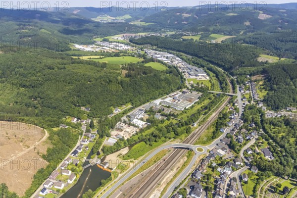 Aerial view, railway tracks Am Bahnhof Finnentrop, industrial area Industriestraße, Finnentrop, Sauerland, North Rhine-Westphalia, Germany, railway tracks, DE, Deutsche Bahn AG, Europe, commercial enterprises, commercial area, commercial location, commercial use, railway tracks, industrial area, industrial building, industrial location, roundabout, roundabout, aerial view, aerial photography, aerial photography, overview, bird's-eye view, overview