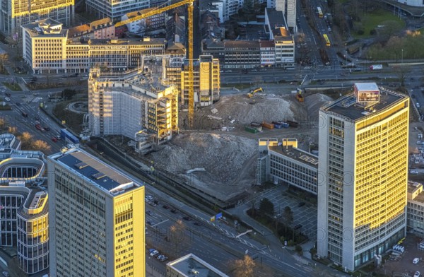 Aerial view, demolition Ypsilon-Haus of the RWE headquarters Essen in the Huyssenallee, planned new building for office campus, in the evening light in the southern district in Essen, Ruhr area, North Rhine-Westphalia, Germany, evening light, demolition work, construction work, construction area, construction site, building plots, building project, building site, office buildings, office complex, DE, energy company, Essen, Europe, commercial buildings, aerial view, aerial photography, aerial photography, overview, bird's eye view, Ypsilon-Haus, birds-eyes view, overview