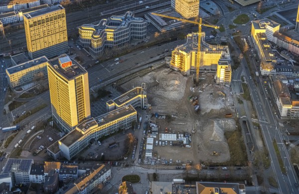 Aerial view, demolition Ypsilon-Haus of the RWE headquarters Essen in the Huyssenallee, planned new building for office campus, in the evening light in the southern district in Essen, Ruhr area, North Rhine-Westphalia, Germany, evening light, demolition work, construction work, construction area, construction site, building plots, building project, building site, office buildings, office complex, DE, energy company, Essen, Europe, commercial buildings, aerial view, aerial photography, aerial photography, overview, bird's eye view, Ypsilon-Haus, birds-eyes view, overview