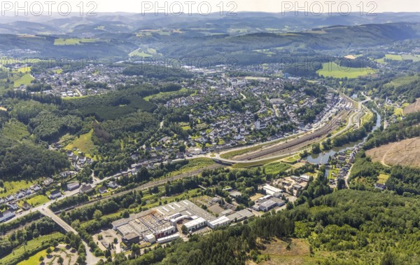 Aerial view, industrial area Am Lennedamm, railway station Finnentrop, Finnentrop, Sauerland, North Rhine-Westphalia, Germany, railway tracks, railway station, bridge, DE, Deutsche Bahn AG, Europe, commercial enterprises, commercial area, commercial area, commercial park, commercial location, commercial use, main station, main railway station, hilly landscape, industrial area, industrial building, industrial location, aerial view, aerial photography, aerial photography, overview, bird's-eye view, birds-eyes view, overview