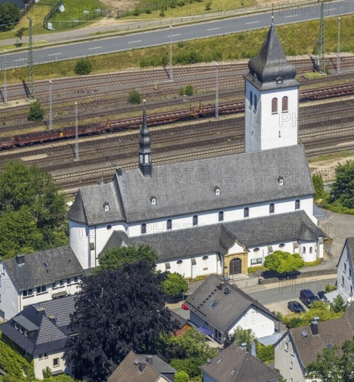 Aerial view, Catholic parish church St. Johannes Nepomuk, Finnentrop, Sauerland, North Rhine-Westphalia, Germany, place of worship, railway tracks, DE, Europe, religious community, place of worship, church, parish, denomination, aerial view, aerial photography, aerial photography, overview, bird's-eye view, overview