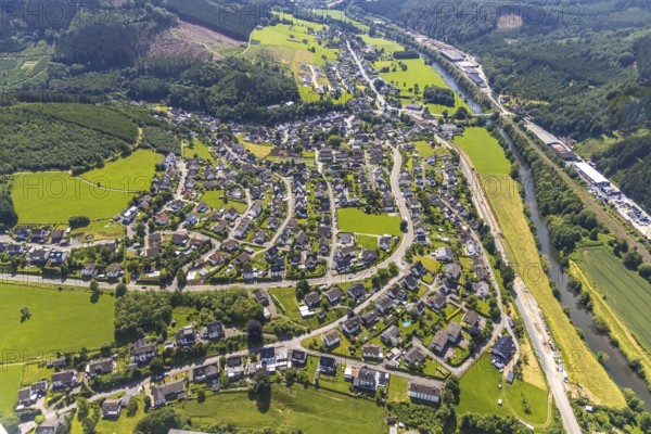 Aerial view, commercial area Bahnhofstraße at the edge of the forest on the Lenne and view of Rönkhausen, Finnentrop, Sauerland, North Rhine-Westphalia, Germany, DE, Europe, commercial enterprises, commercial area, commercial park, commercial location, commercial use, property tax, real estate, industrial area, industrial building, industrial location, aerial photograph, aerial photography, aerial photography, overview, bird's-eye view, forest area, residential area, housing and living, residential area, residential buildings, residential quality, housing estate, bird's-eye view, overview