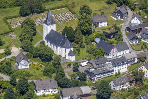 Aerial view, view of Schönholthausen, Kath. Pfarrkirche Mariä Himmelfahrt, Finnentrop, Sauerland, North Rhine-Westphalia, Germany, place of worship, burial place, DE, Europe, cemetery, memorial, religious community, place of worship, house of God, land tax, burial ground, holy place, real estate, church, parish, denomination, aerial view, aerial photography, aerial photography, religion, religious site, resting place, overview, bird's-eye view, housing estate, housing and living, residential area, residential buildings, housing quality, housing estate, birds-eyes view, overview