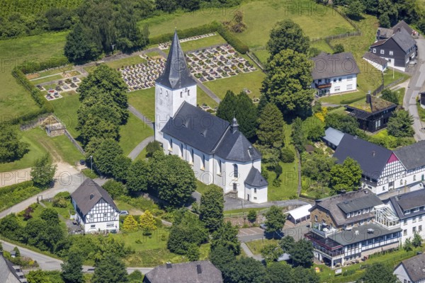 Aerial view, view of Schönholthausen, Kath. Pfarrkirche Mariä Himmelfahrt, Finnentrop, Sauerland, North Rhine-Westphalia, Germany, place of worship, burial place, DE, Europe, cemetery, memorial, religious community, place of worship, house of God, land tax, burial ground, holy place, real estate, church, parish, denomination, aerial view, aerial photography, aerial photography, religion, religious site, resting place, overview, bird's-eye view, housing estate, housing and living, residential area, residential buildings, housing quality, housing estate, birds-eyes view, overview