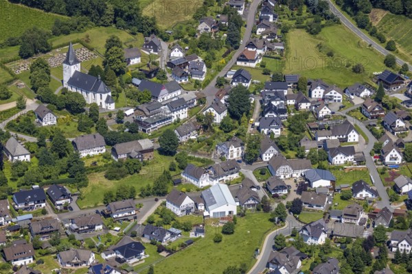 Aerial view, view of Schönholthausen, Kath. Pfarrkirche Mariä Himmelfahrt, Finnentrop, Sauerland, North Rhine-Westphalia, Germany, place of worship, burial place, DE, Europe, cemetery, memorial, religious community, place of worship, house of God, land tax, burial ground, holy place, real estate, church, parish, denomination, aerial view, aerial photography, aerial photography, religion, religious site, resting place, overview, bird's-eye view, housing estate, housing and living, residential area, residential buildings, housing quality, housing estate, birds-eyes view, overview